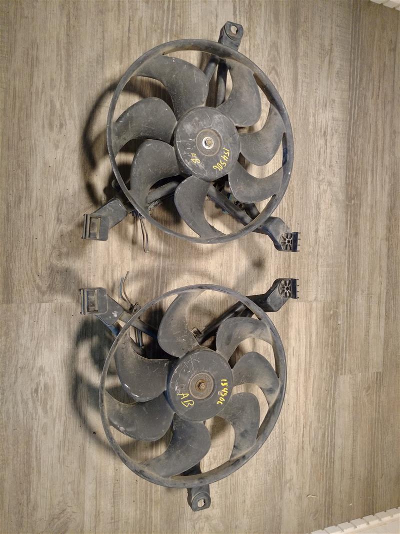 Radiator Fan Assembly from a 1997 Pontiac Grand Prix, left side, photo 1