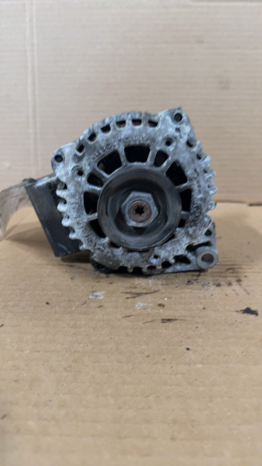 Alternator from a 2001 Oldsmobile Alero, photo 1