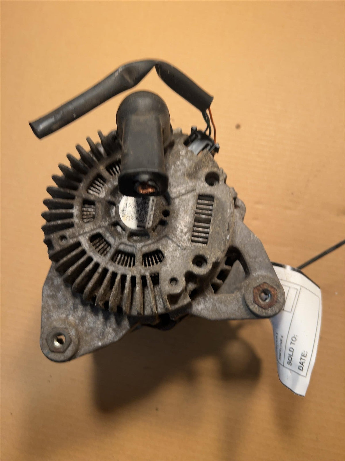 Alternator from a 2017 Nissan Versa, photo 1