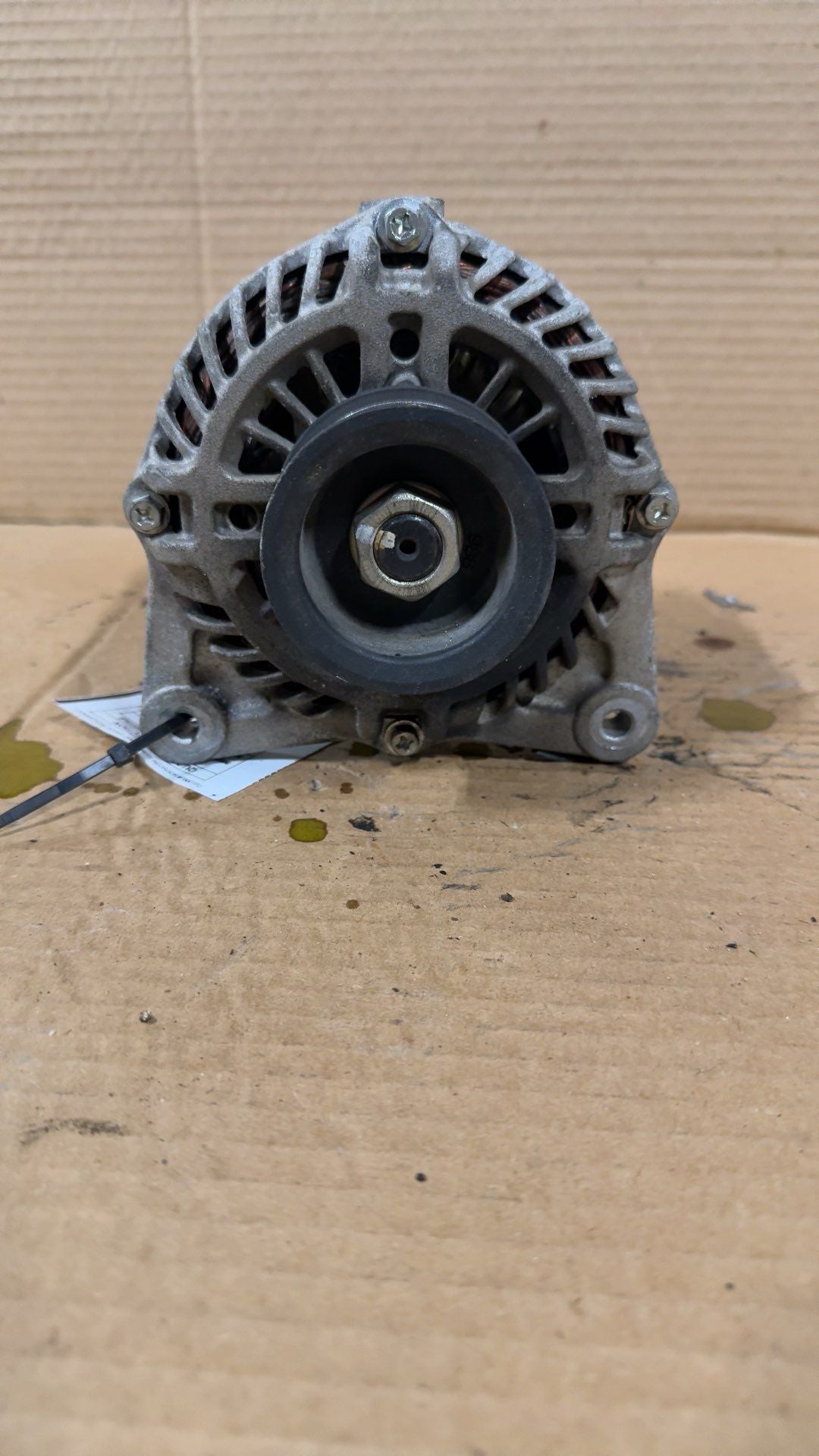Alternator from a 2015 Nissan Versa, photo 1