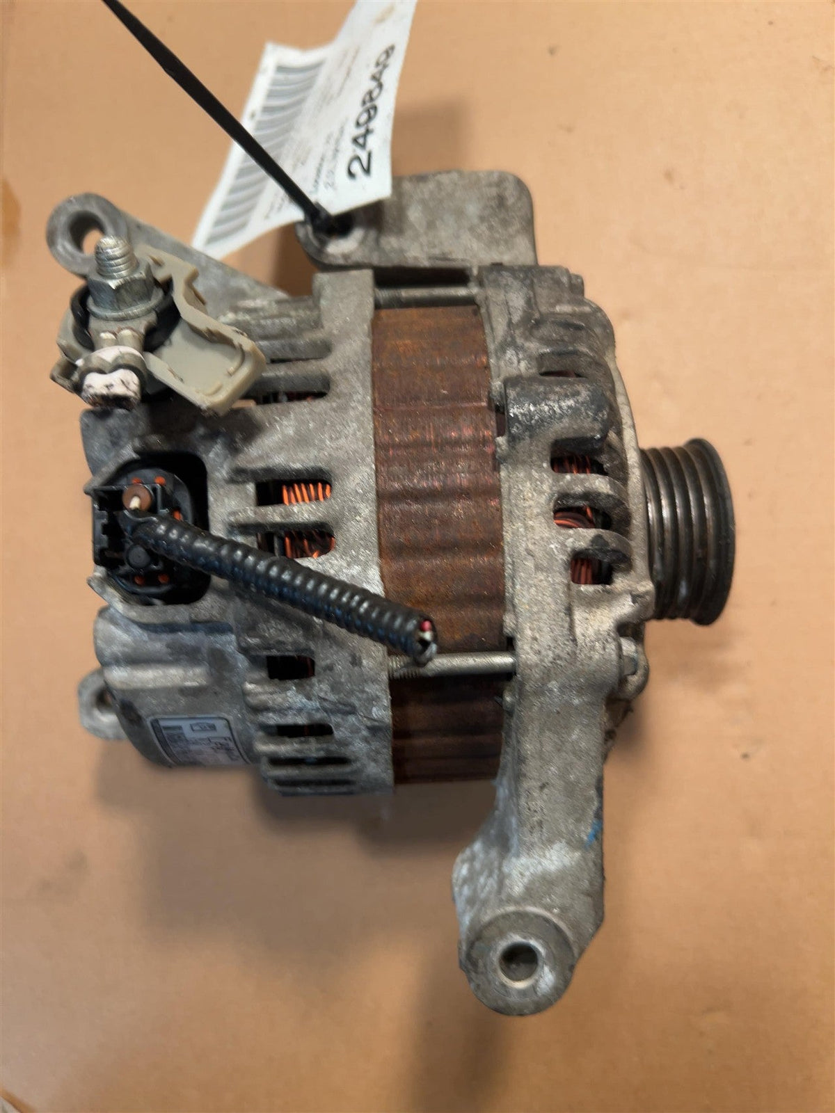 Alternator from a 2010 Mazda 3, photo 1