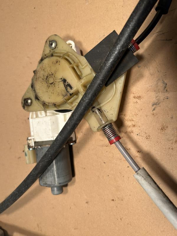 Window Regulator from a 2008 Jeep Patriot, front, left side, photo 1