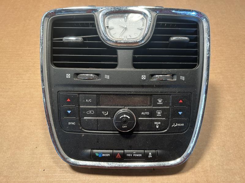Climate Control Panel from a 2012 Dodge Caravan, front, photo 1