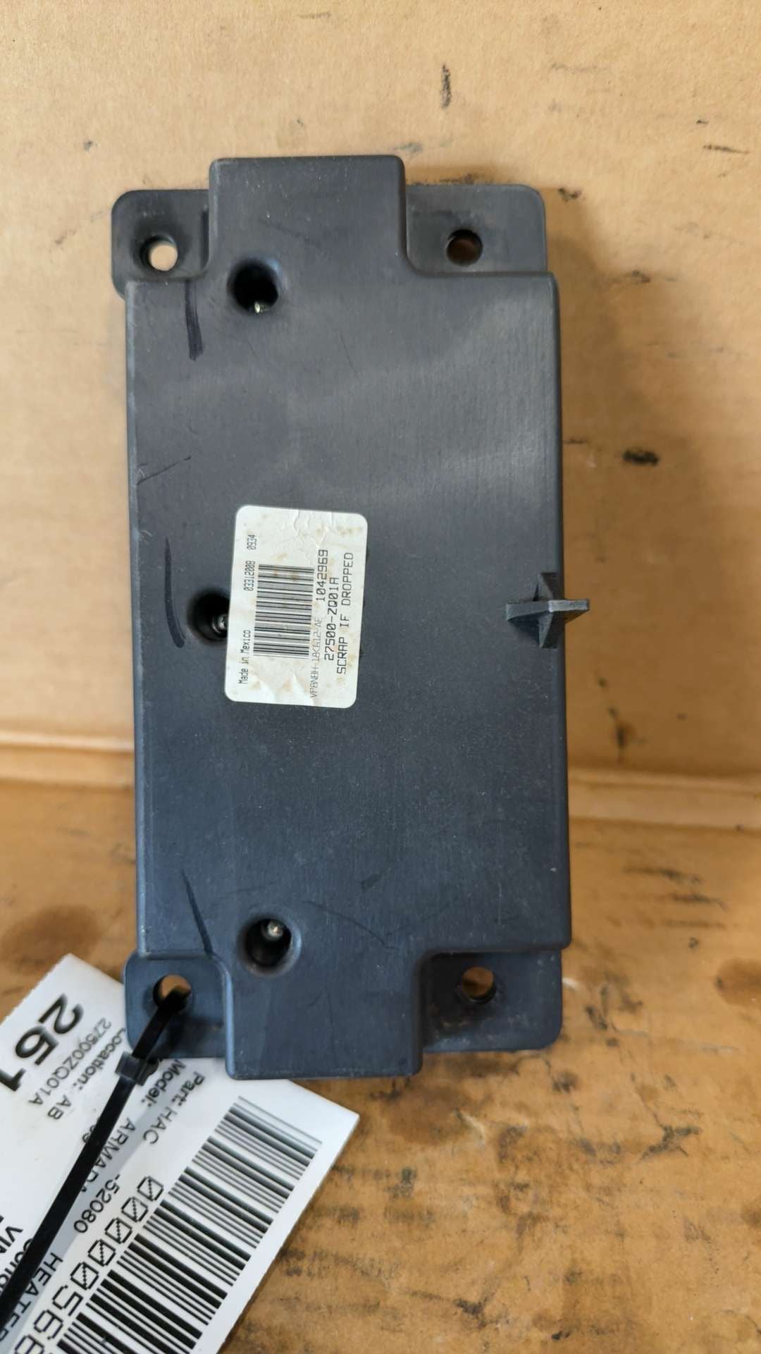 Climate Control Panel from a 2009 Nissan Armada, front, photo 1