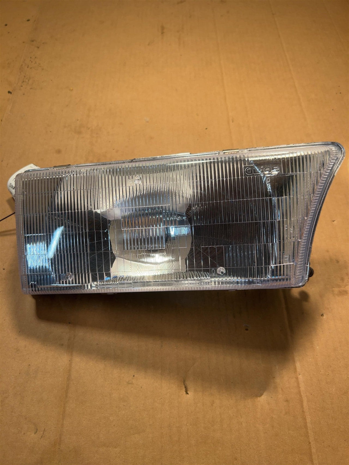 Headlight Assembly from a 1992 Buick Roadmaster, right side, photo 2