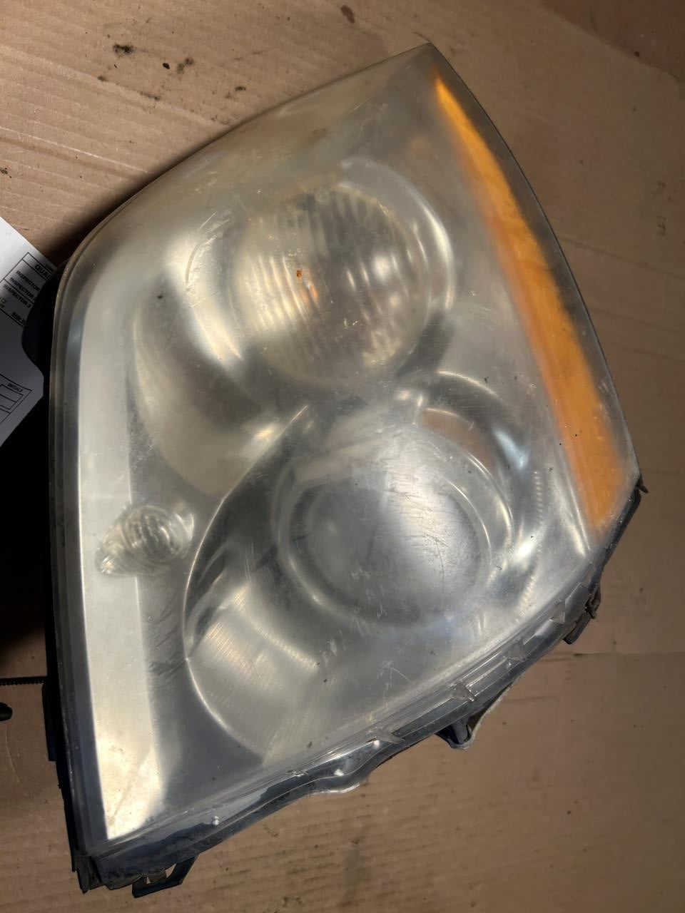 Headlight Assembly from a 2007 Cadillac, left side, photo 2