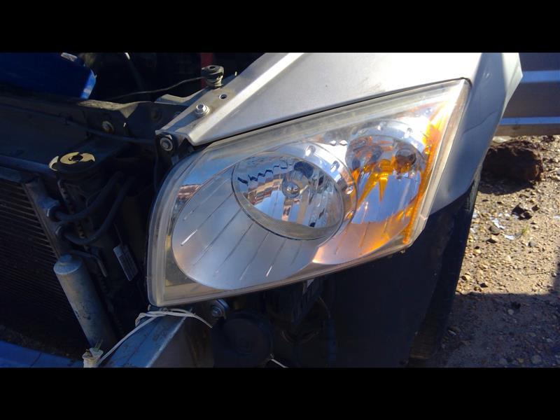 Headlight Assembly from a 2010 Dodge Caliber, left side, photo 1
