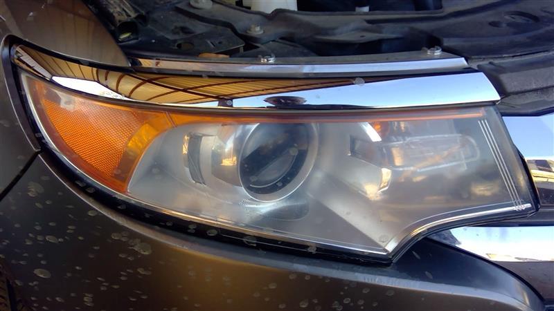 Headlight Assembly from a 2014 Ford Edge, right side, photo 1