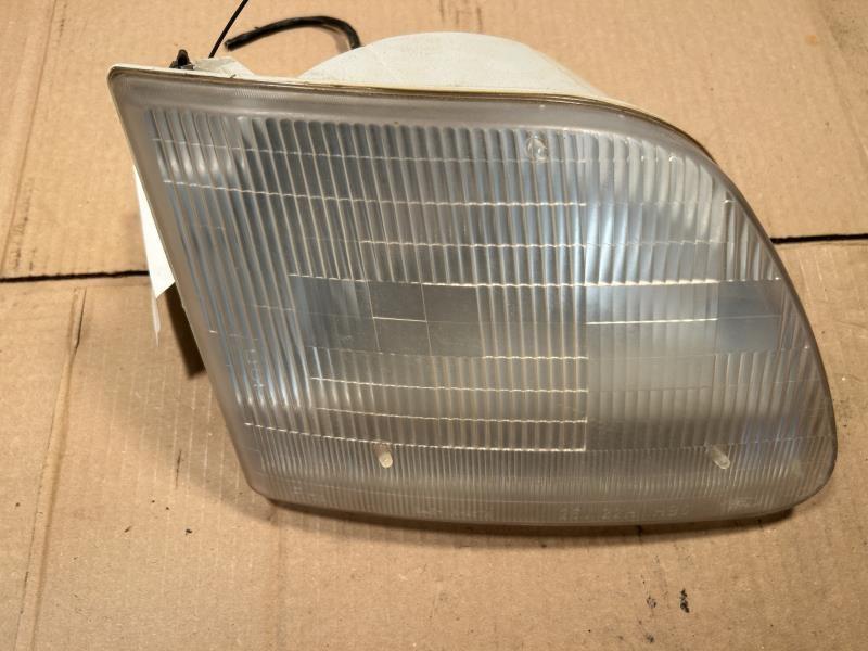 Headlight Assembly from a 1997 Ford F-150, right side, photo 1