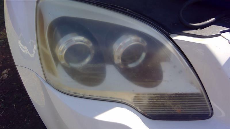 Headlight Assembly from a 2008 GMC Acadia, right side, photo 1