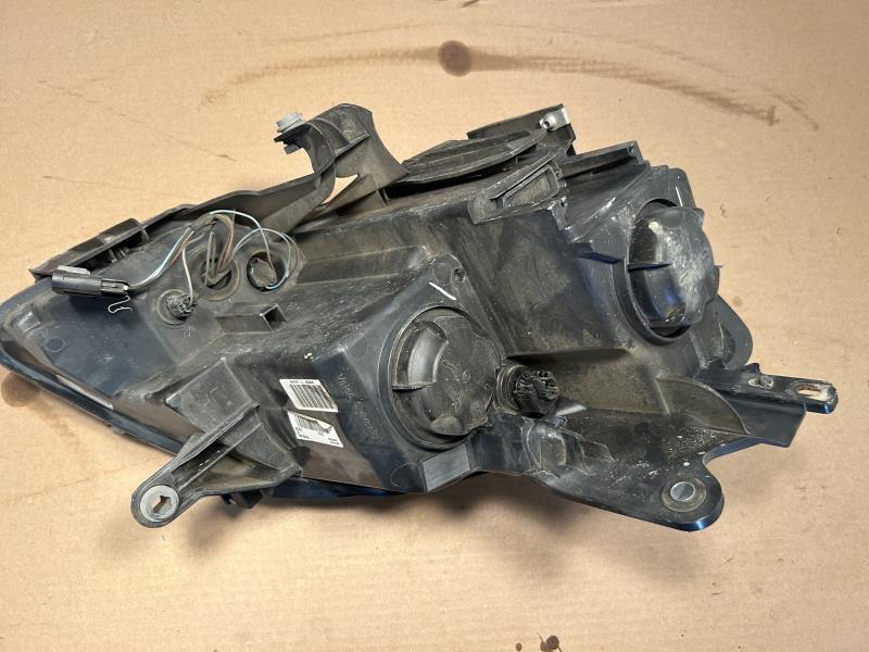 Headlight Assembly from a 2008 GMC Acadia, left side, photo 3