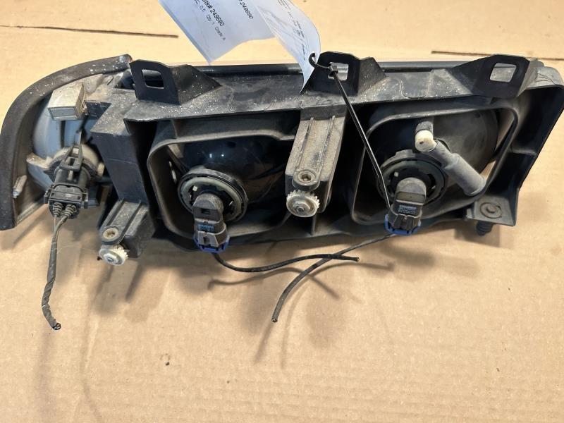 Headlight Assembly from a 1996 BMW 328i, left side, photo 3