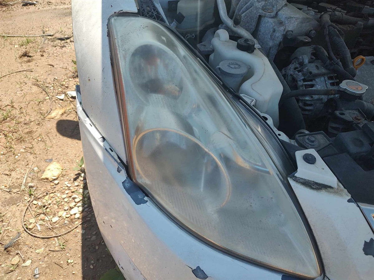 Headlight Assembly from a 2010 Nissan Altima, right side, photo 1