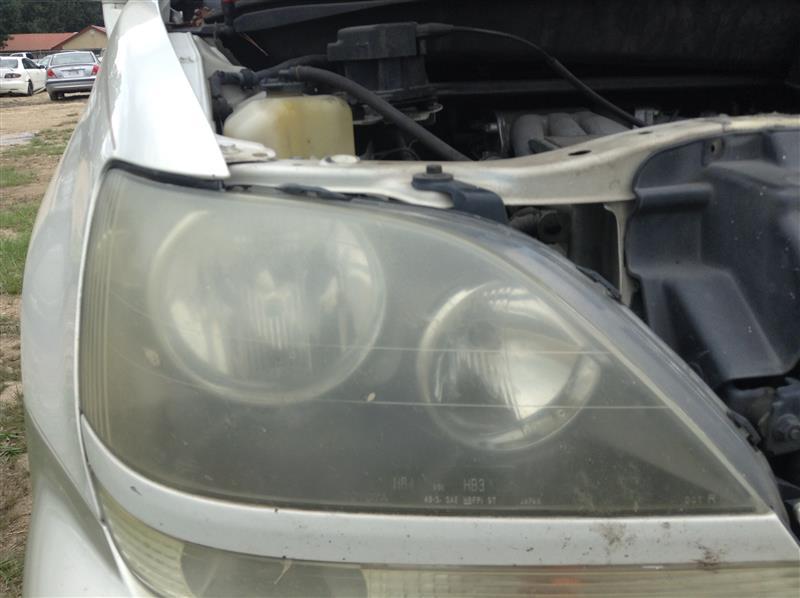 Headlight Assembly from a 1999 Lexus RX300, right side, photo 1