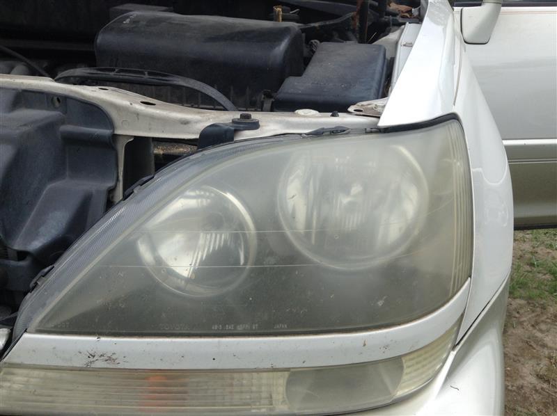 Headlight Assembly from a 1999 Lexus RX300, left side, photo 1