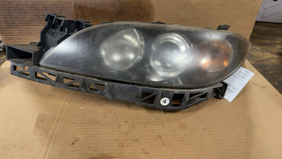 Headlight Assembly from a 2006 Mazda 3, left side, photo 1