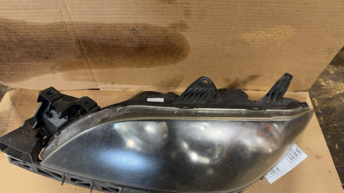 Headlight Assembly from a 2006 Mazda 3, left side, photo 2