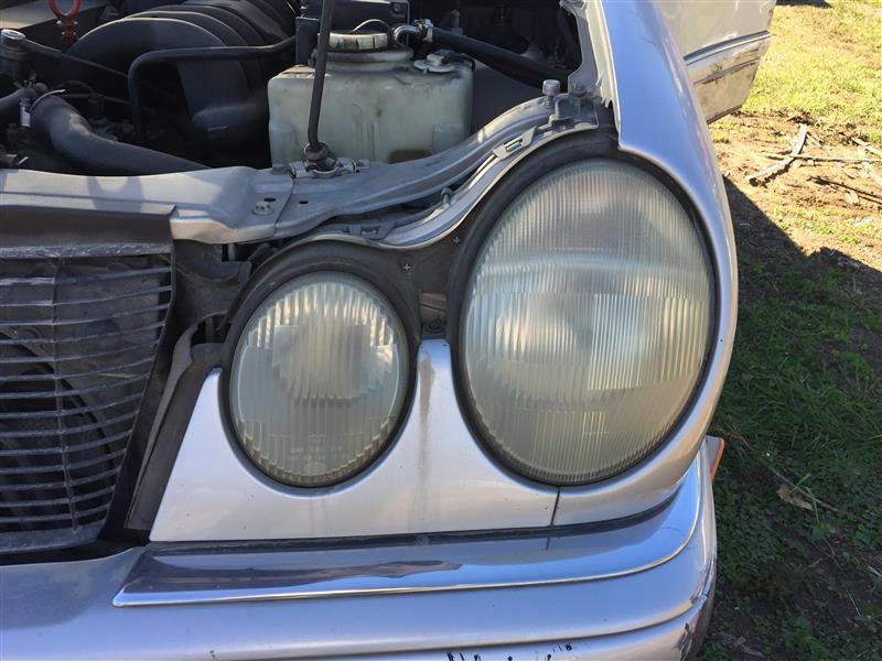 Headlight Assembly from a 1997 Mercedes-Benz E-Class, left side, photo 1