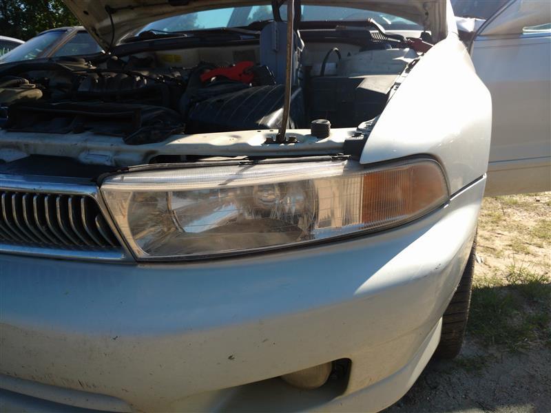 Headlight Assembly from a 2001 Mitsubishi Galant, left side, photo 1