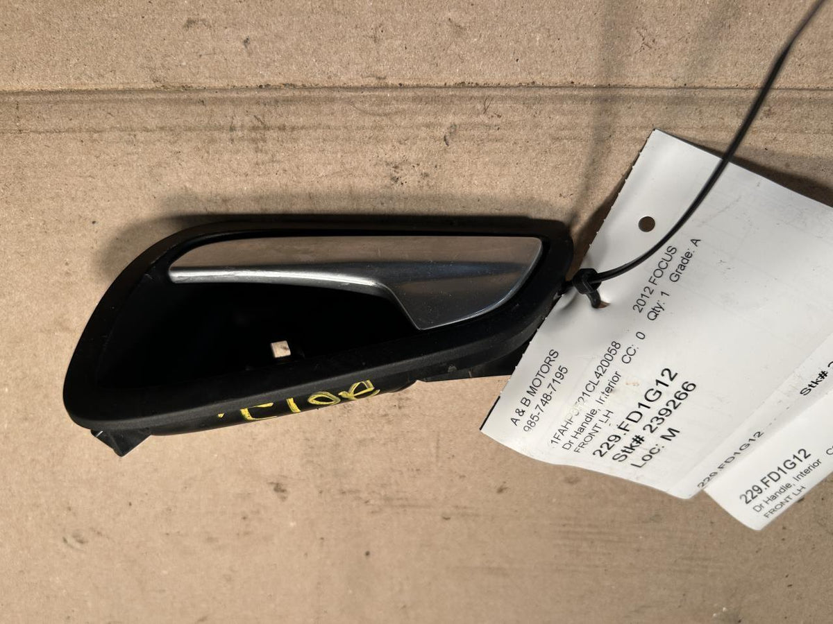 Exterior Door Handle from a 2012 Ford Focus, front, left side, photo 1