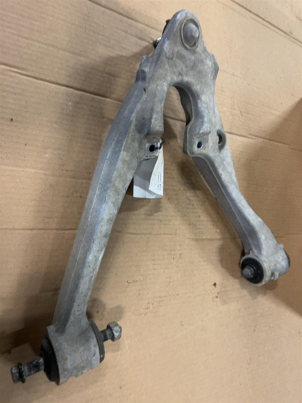 Lower Control Arm from a 2010 Chevrolet Tahoe, front, left side, photo 2