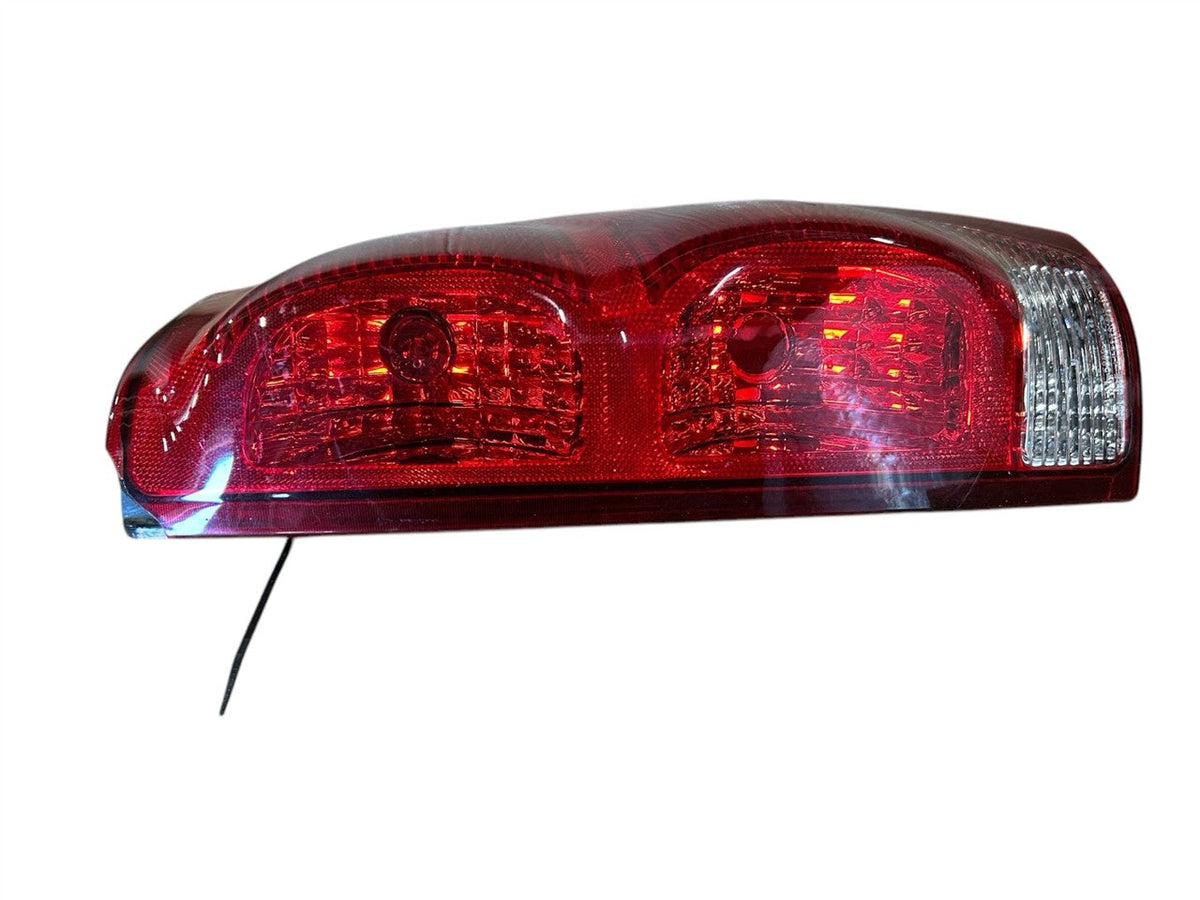 Tail Light from a 2004 Chevrolet Avalanche 1500, right side, photo 1