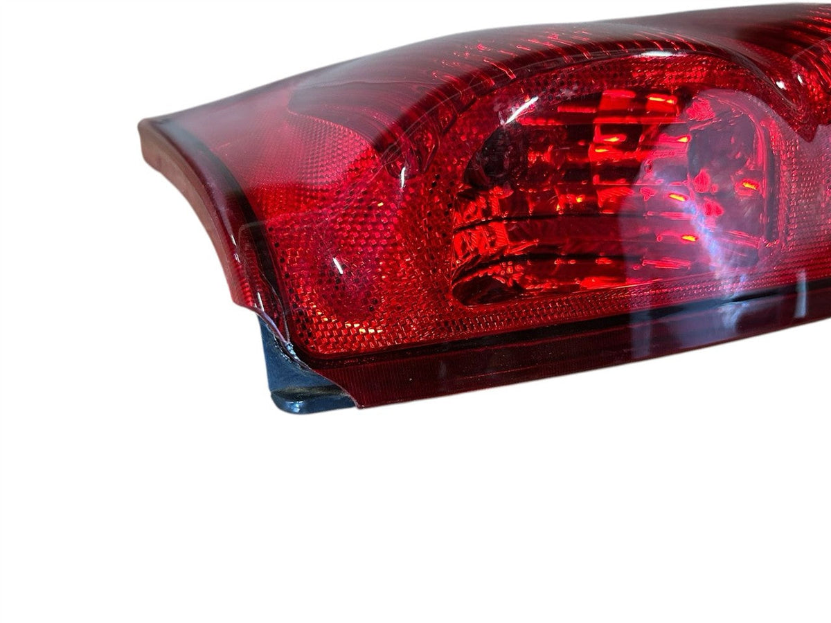 Tail Light from a 2004 Chevrolet Avalanche 1500, right side, photo 3