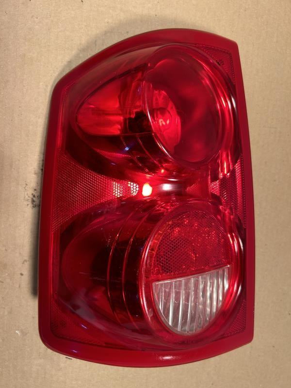 Tail Light from a 2005 Dodge Dakota, left side, photo 2