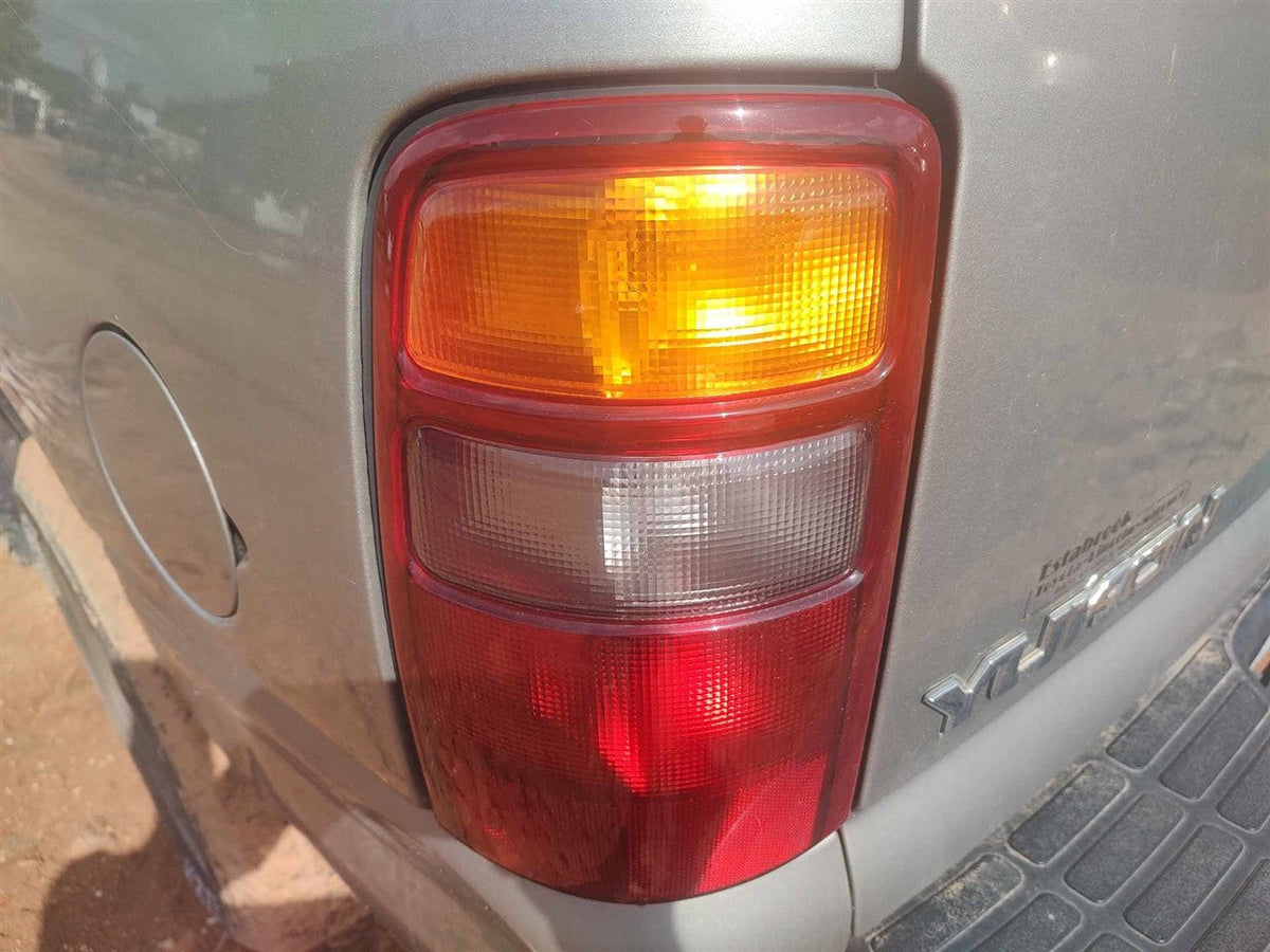 Tail Light from a 2002 GMC Yukon, left side, photo 1