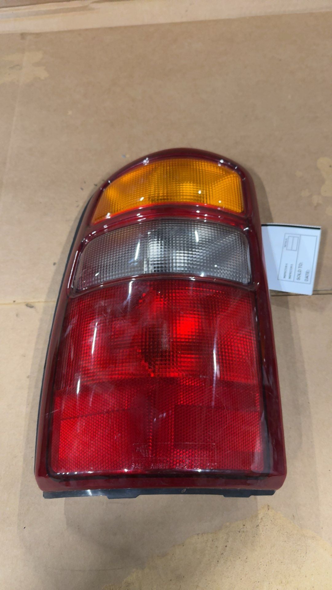 Tail Light from a 2002 GMC Yukon, left side, photo 3