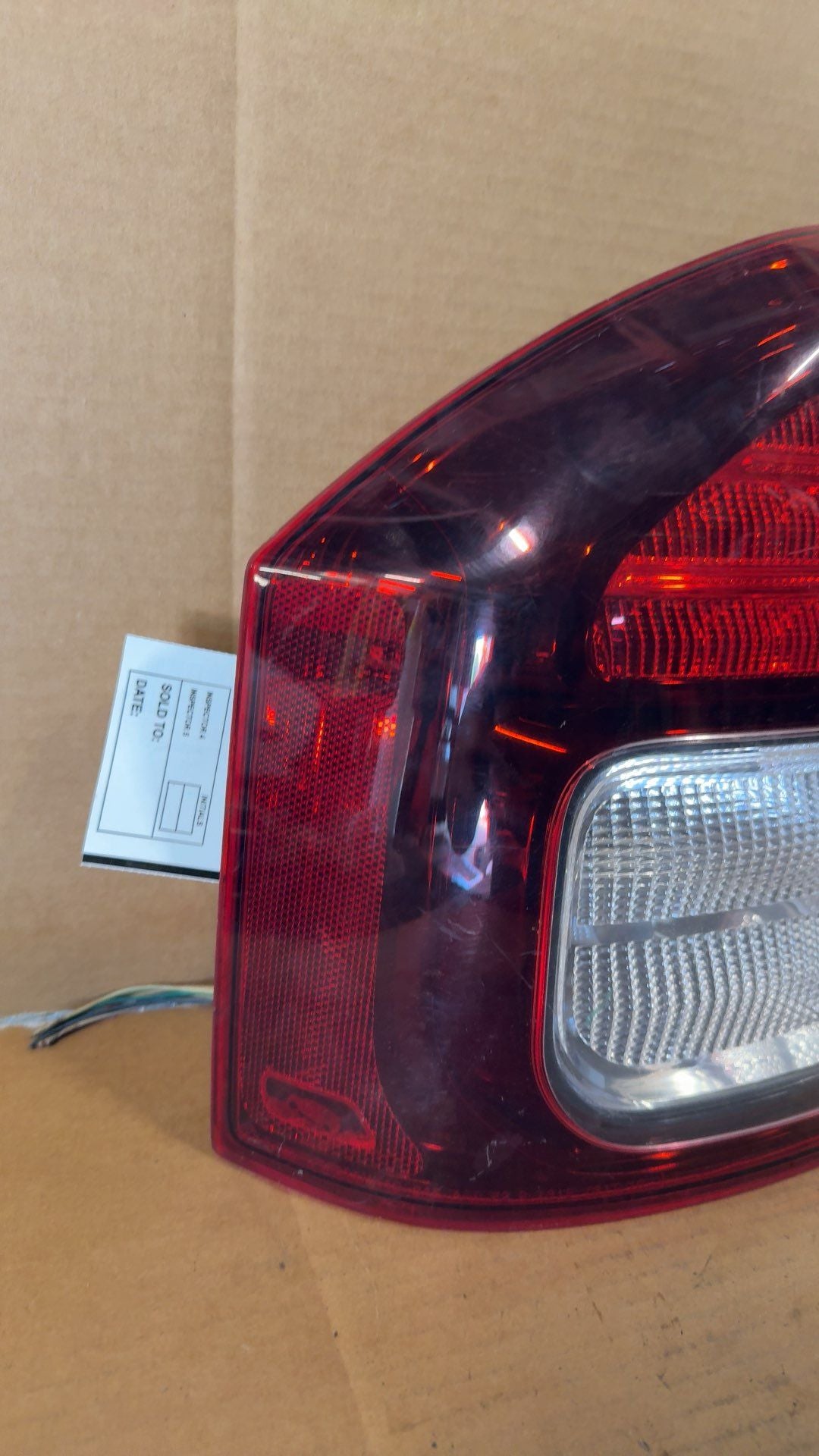Tail Light from a 2014 Jeep Compass, left side, photo 2