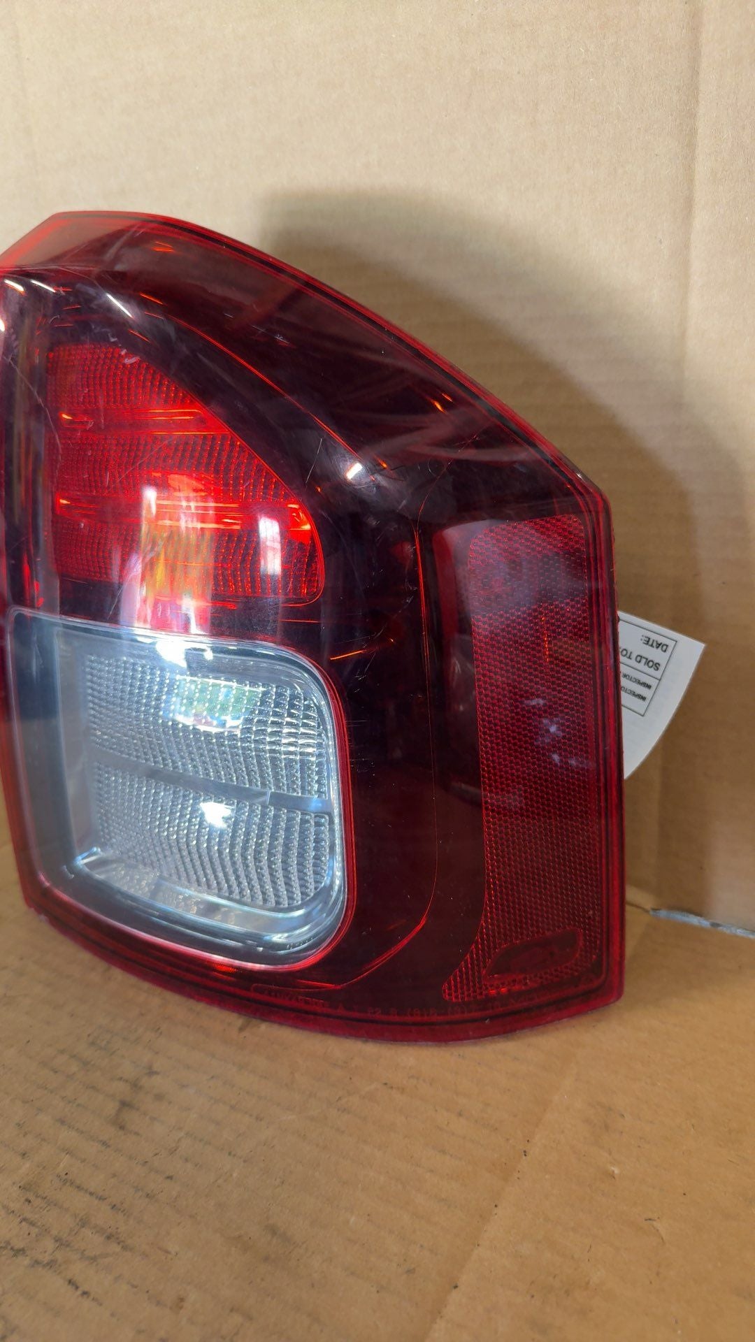 Tail Light from a 2014 Jeep Compass, right side, photo 2