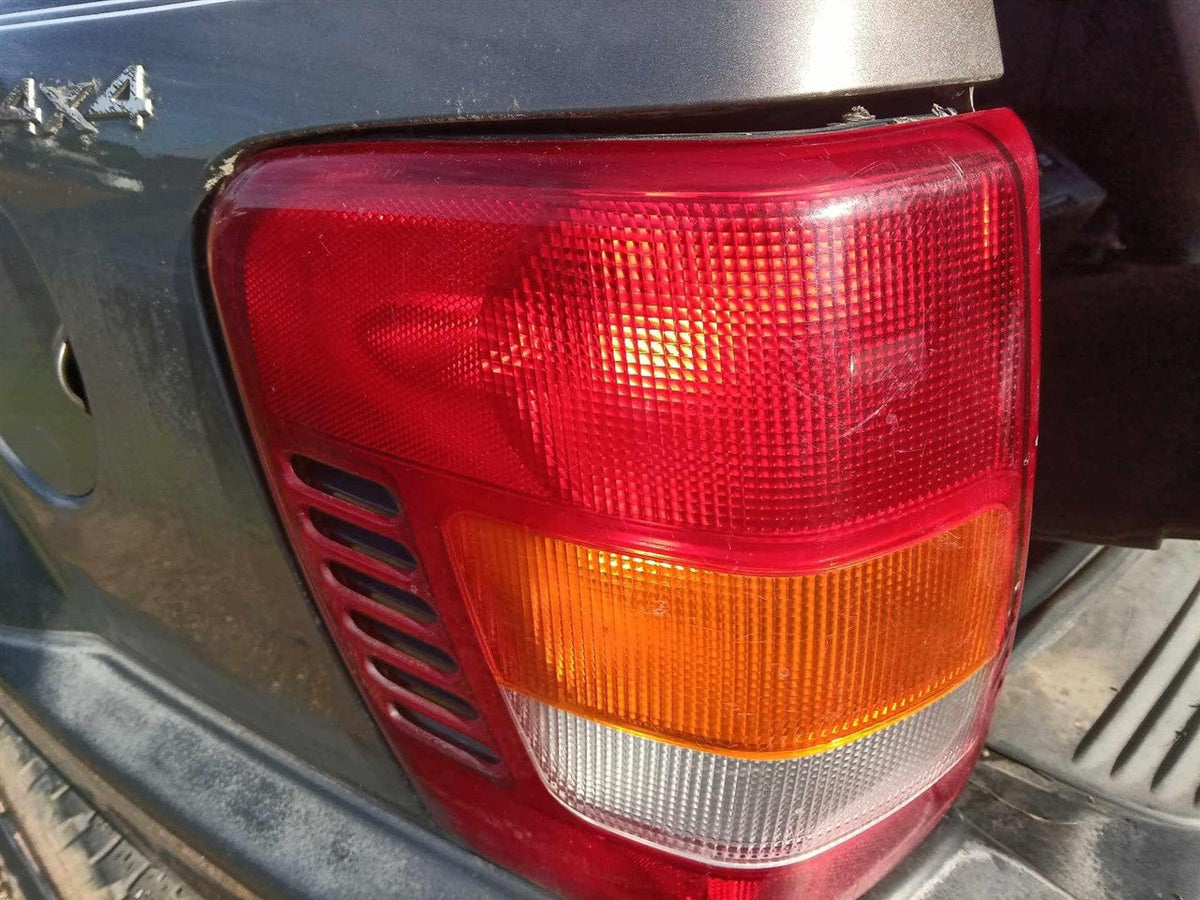 Tail Light from a 2000 Jeep Grand Cherokee, left side, photo 1
