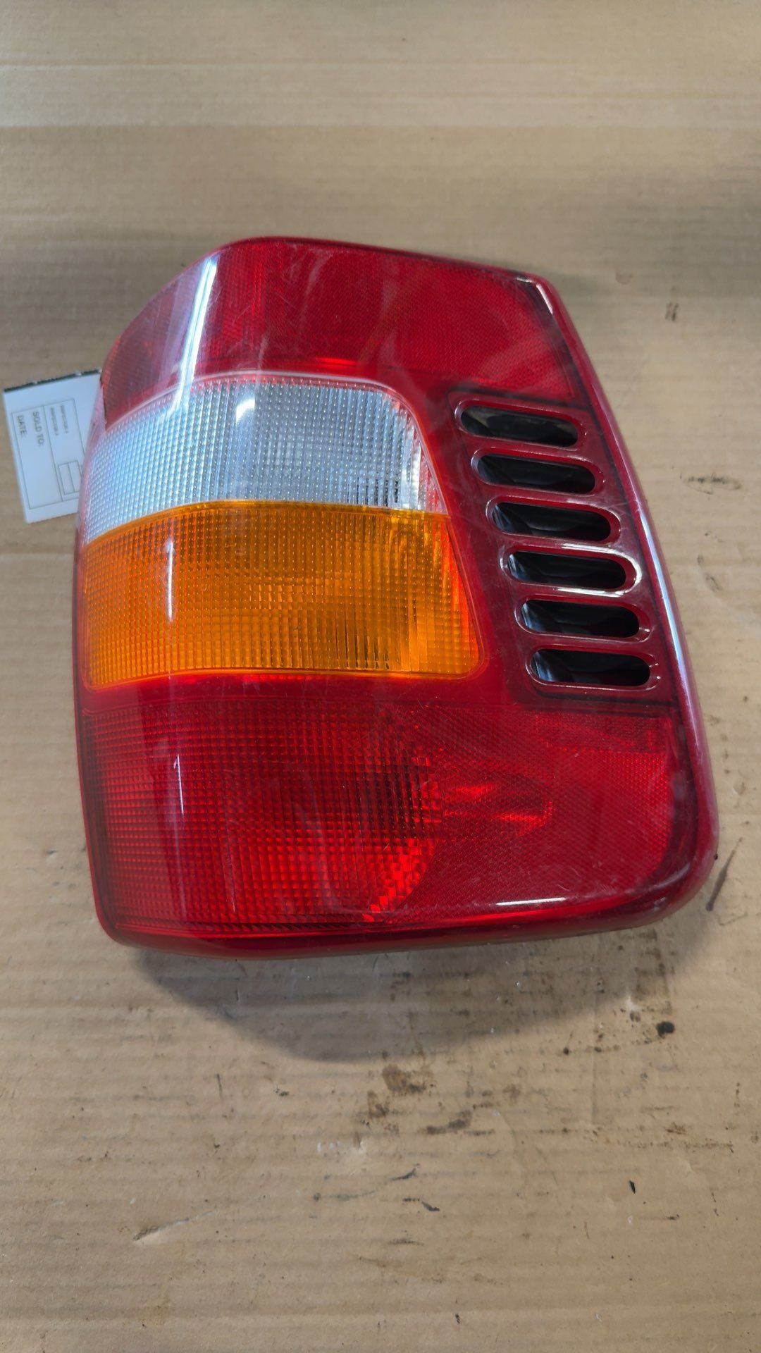 Tail Light from a 2000 Jeep Grand Cherokee, left side, photo 2