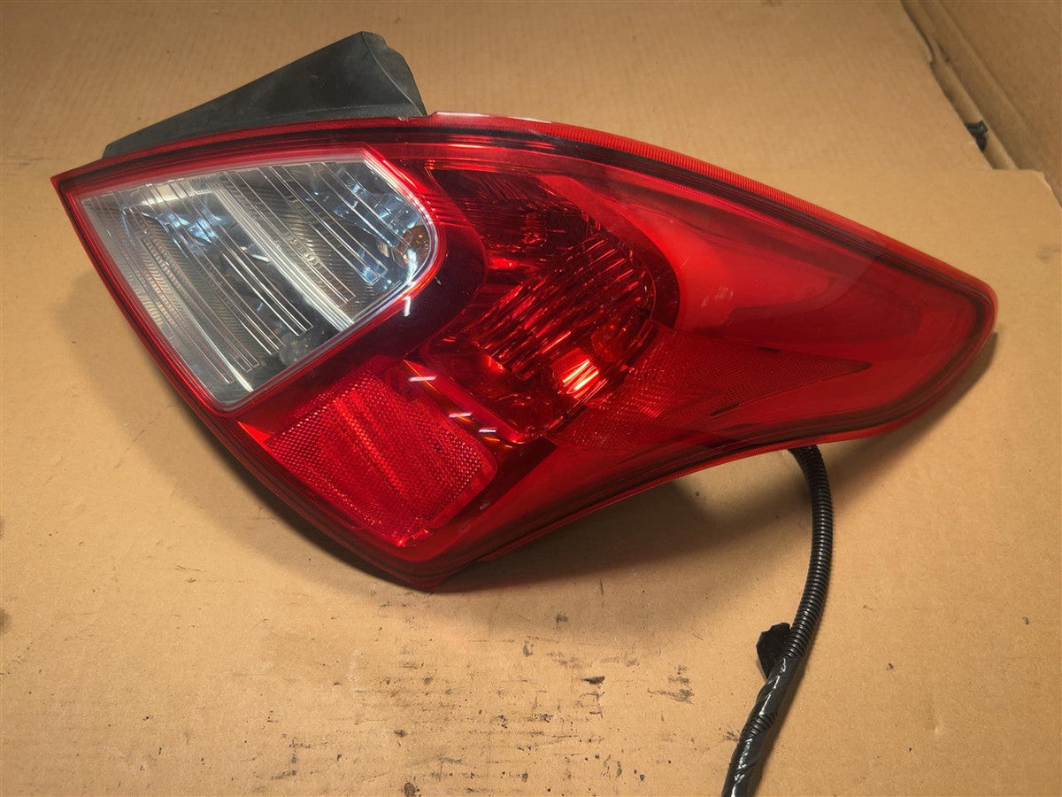 Tail Light from a 2012 Nissan Versa, right side, photo 2
