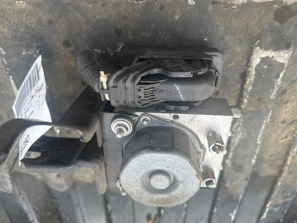 ABS Pump Module from a 2012 Nissan Versa, photo 1