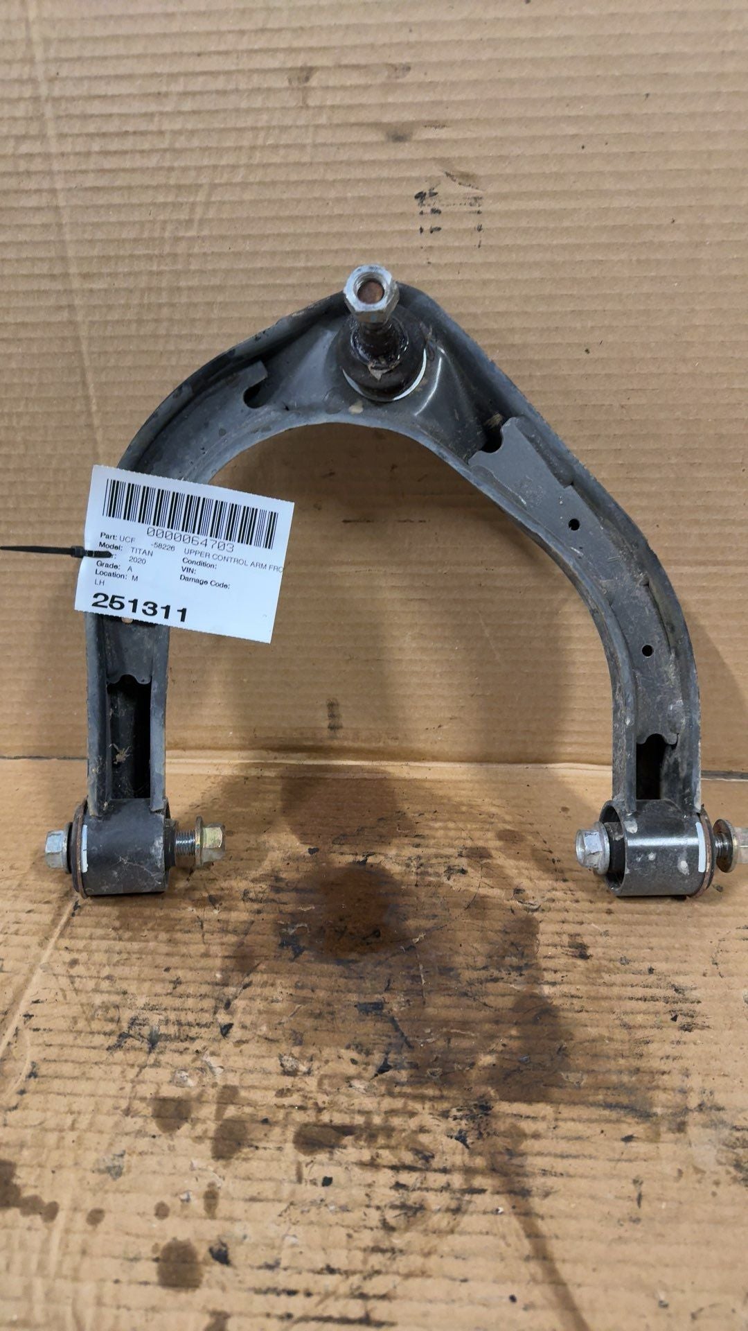 Upper Control Arm from a 2020 Nissan Titan, front, left side, photo 1