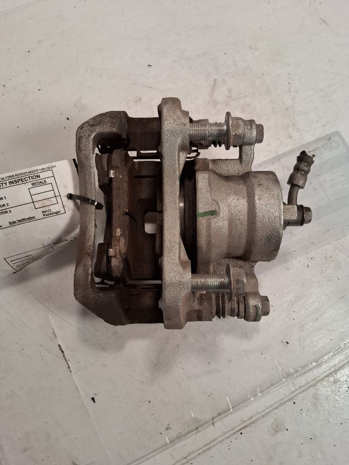 Brake Caliper from a 2022 Nissan Versa, front, left side, photo 1