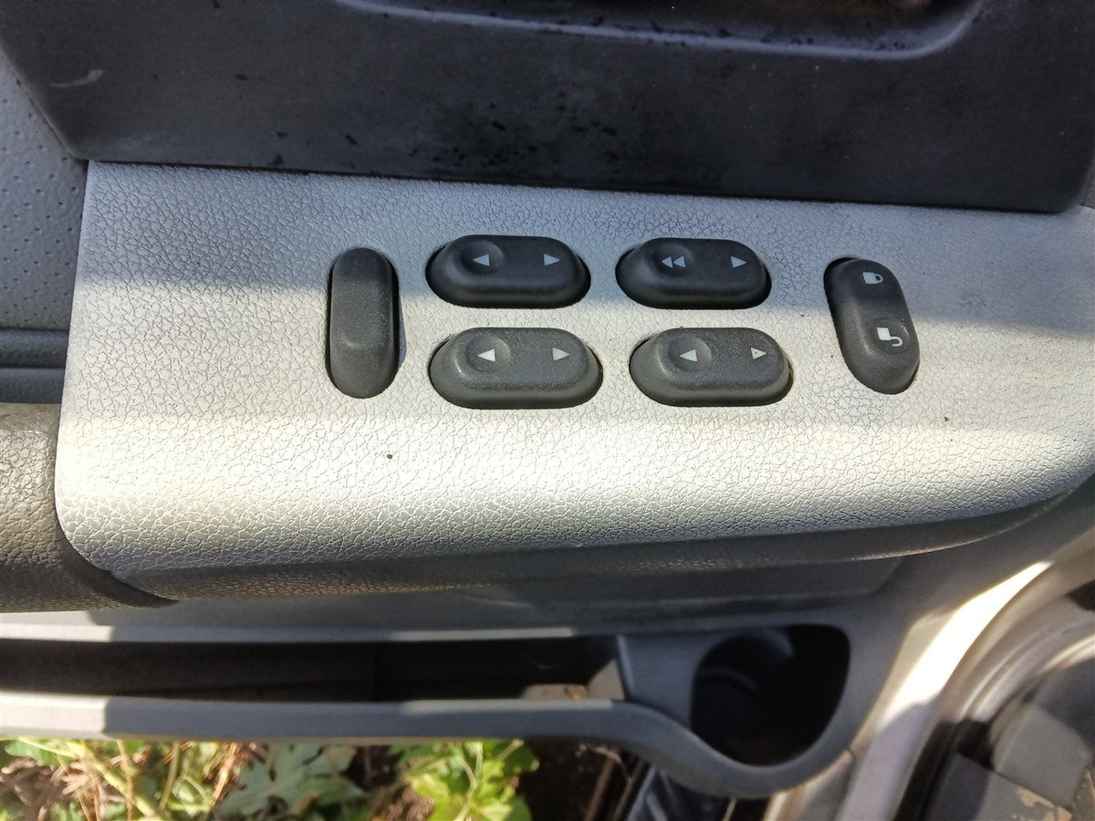 Window Master Switch from a 2006 Ford Expedition, left side, photo 1