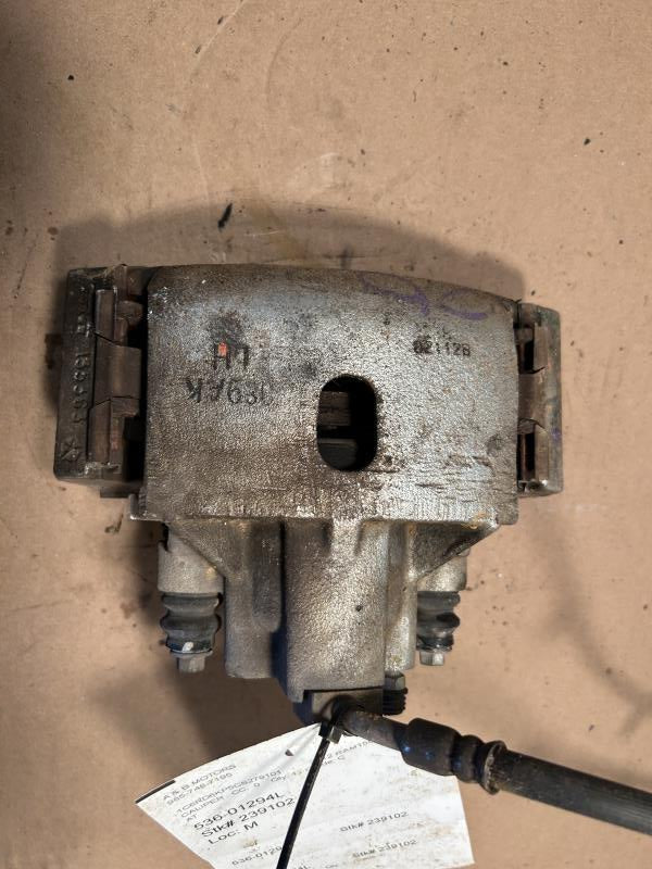 Brake Caliper from a 2012 Ram 1500, front, left side, photo 1