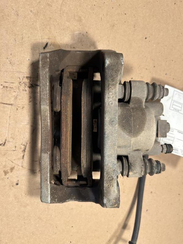 Brake Caliper from a 2012 Ram 1500, front, left side, photo 2