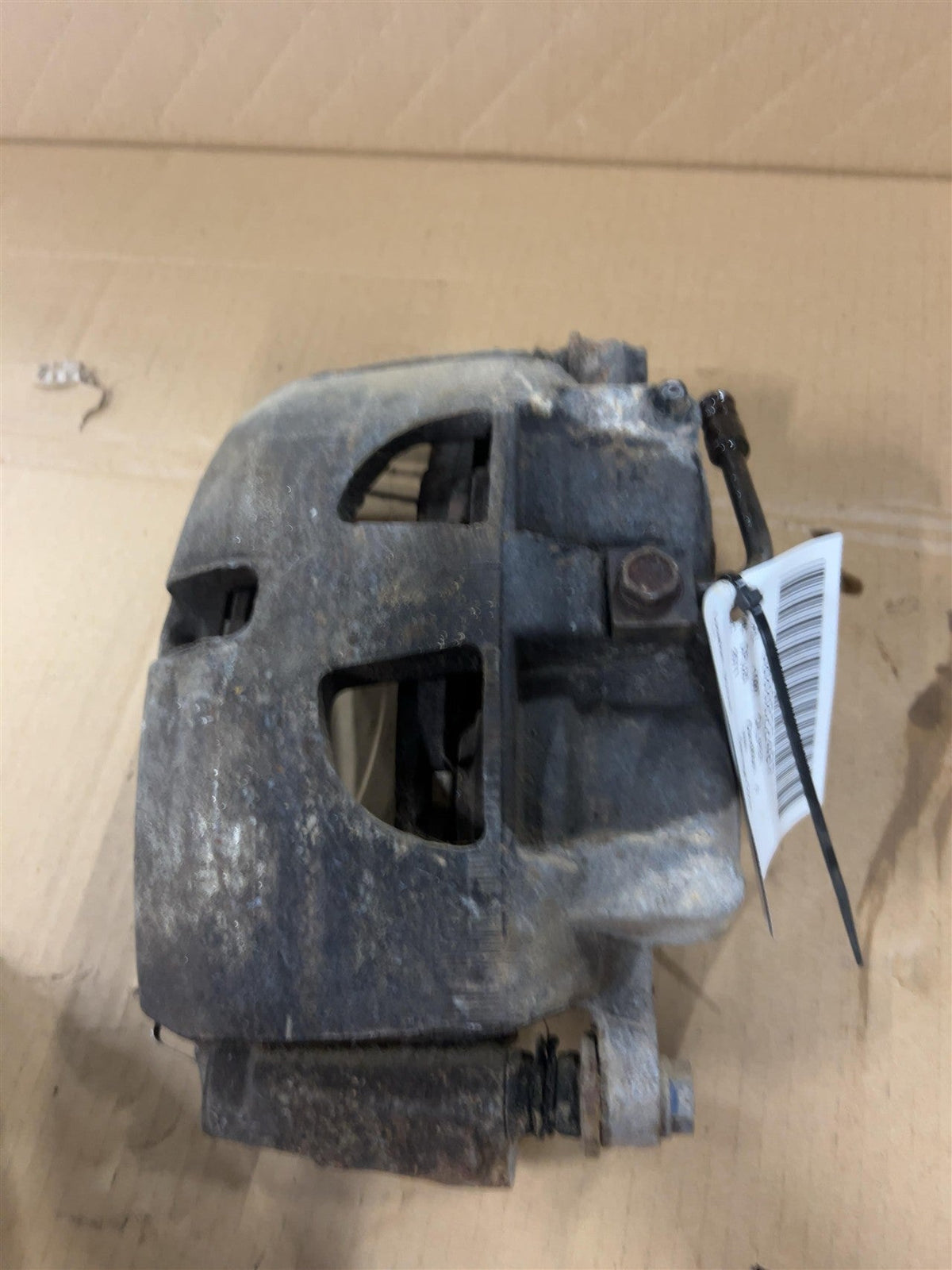 Brake Caliper from a 2011 Ram 2500, front, left side, photo 2