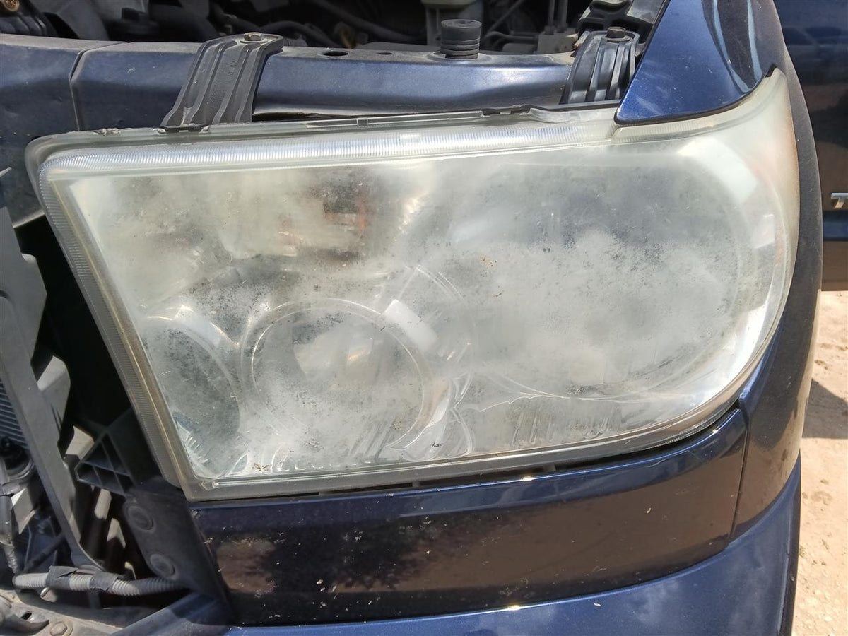 Headlight Assembly from a 2010 Toyota Tundra, left side, photo 1