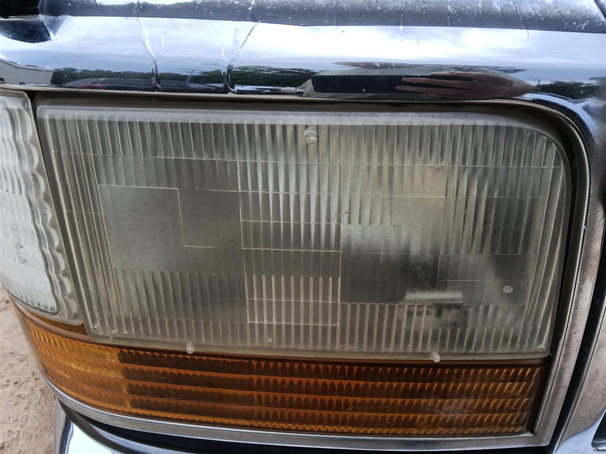Headlight Assembly from a 1992 Ford F-150, right side, photo 1