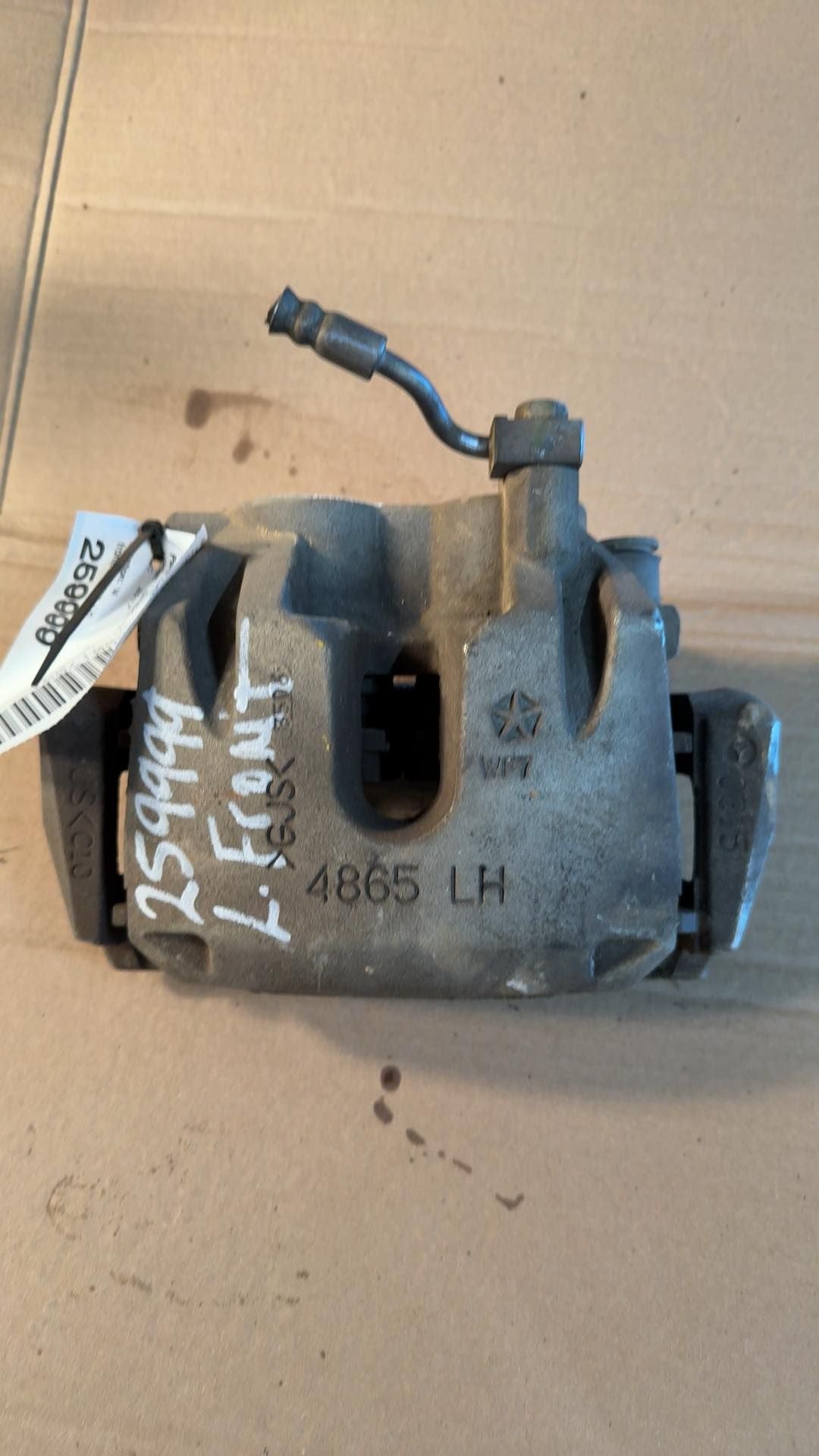 Brake Caliper from a 2017 Jeep Grand Cherokee, front, left side, photo 1