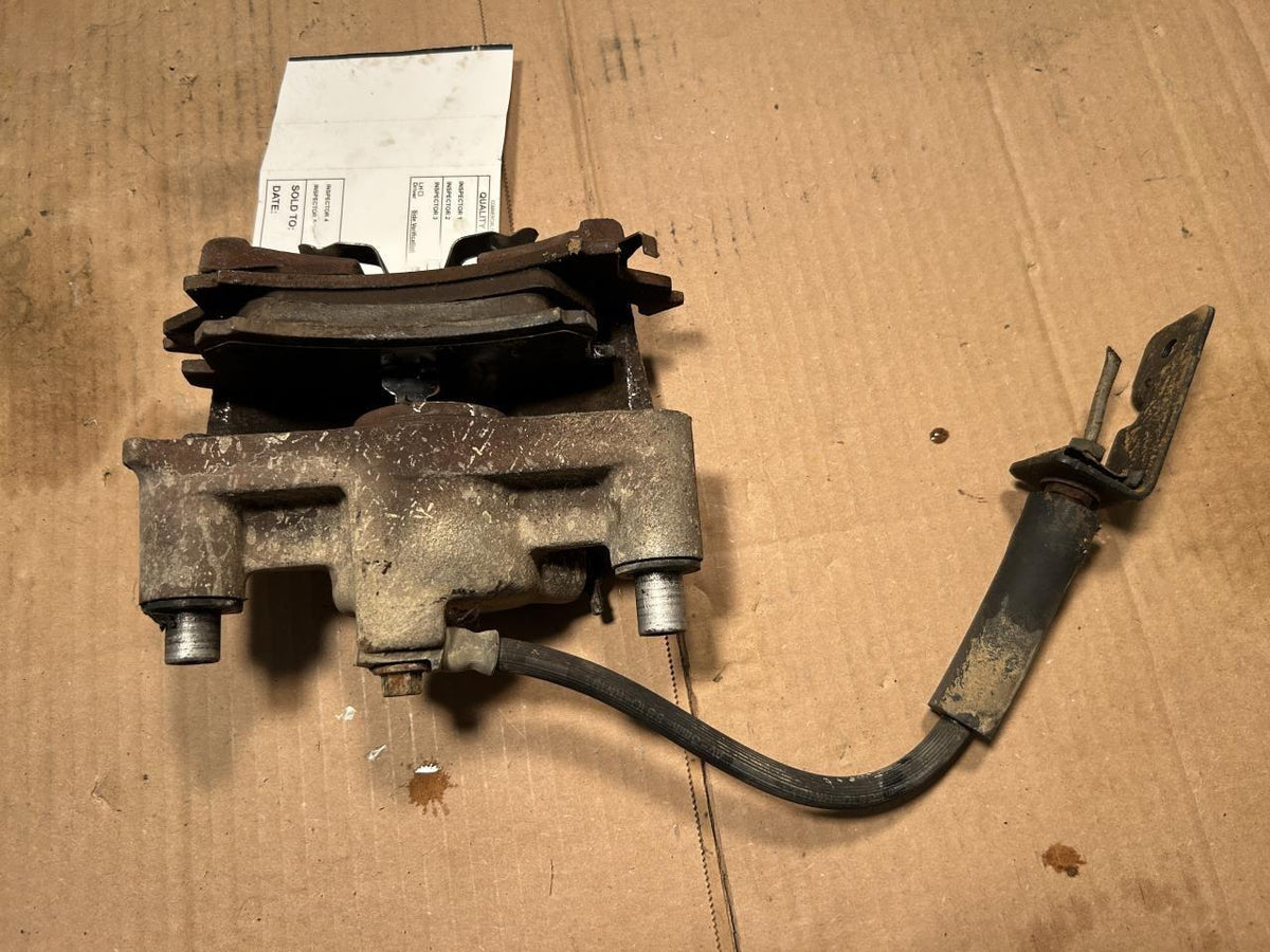 Brake Caliper from a 2002 Pontiac Sunfire, front, left side, photo 1