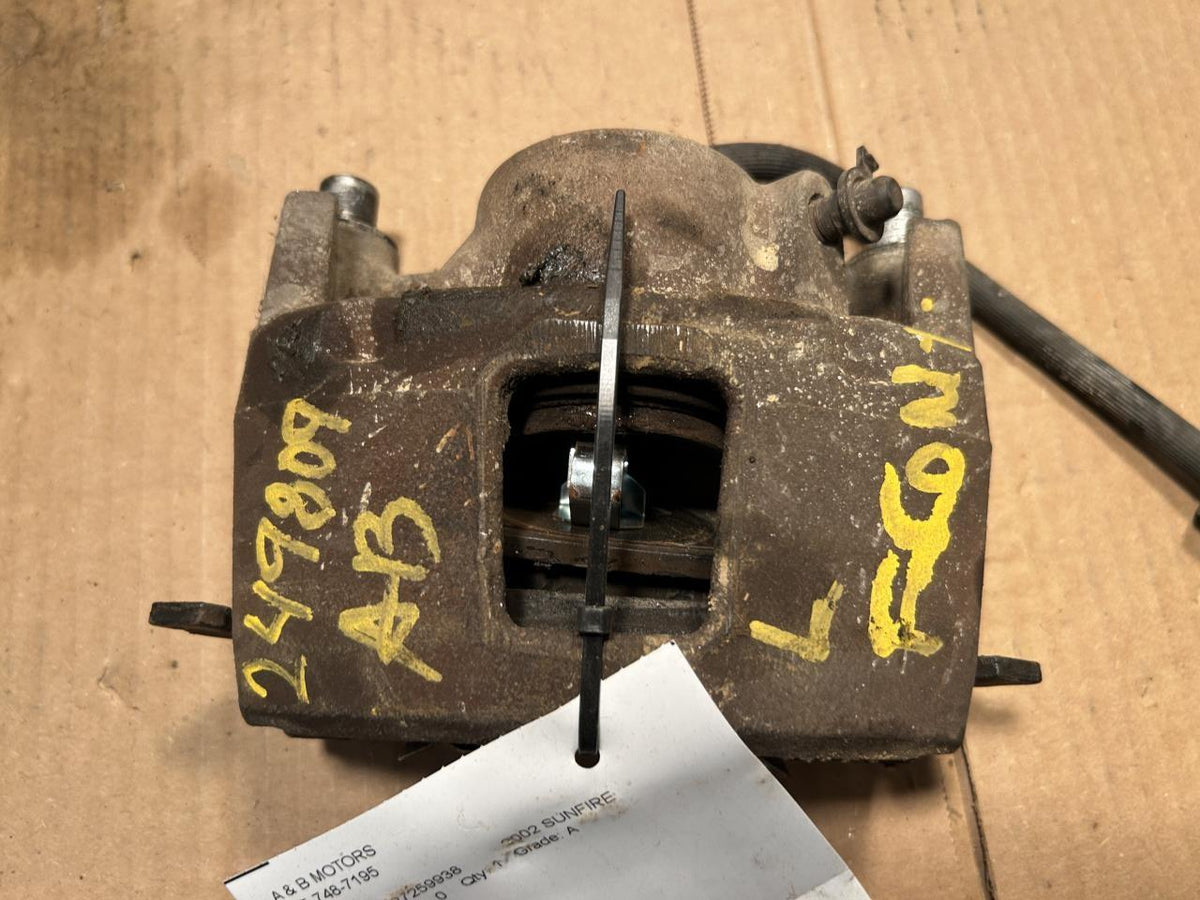 Brake Caliper from a 2002 Pontiac Sunfire, front, left side, photo 2