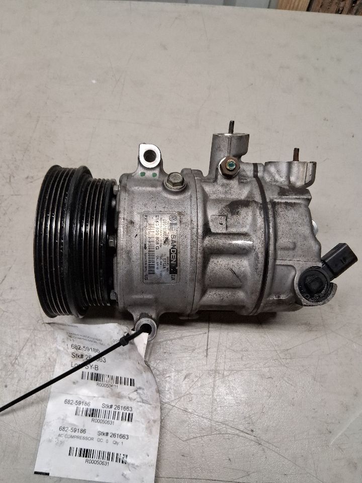 AC Compressor from a 2013 Volkswagen Passat, photo 1