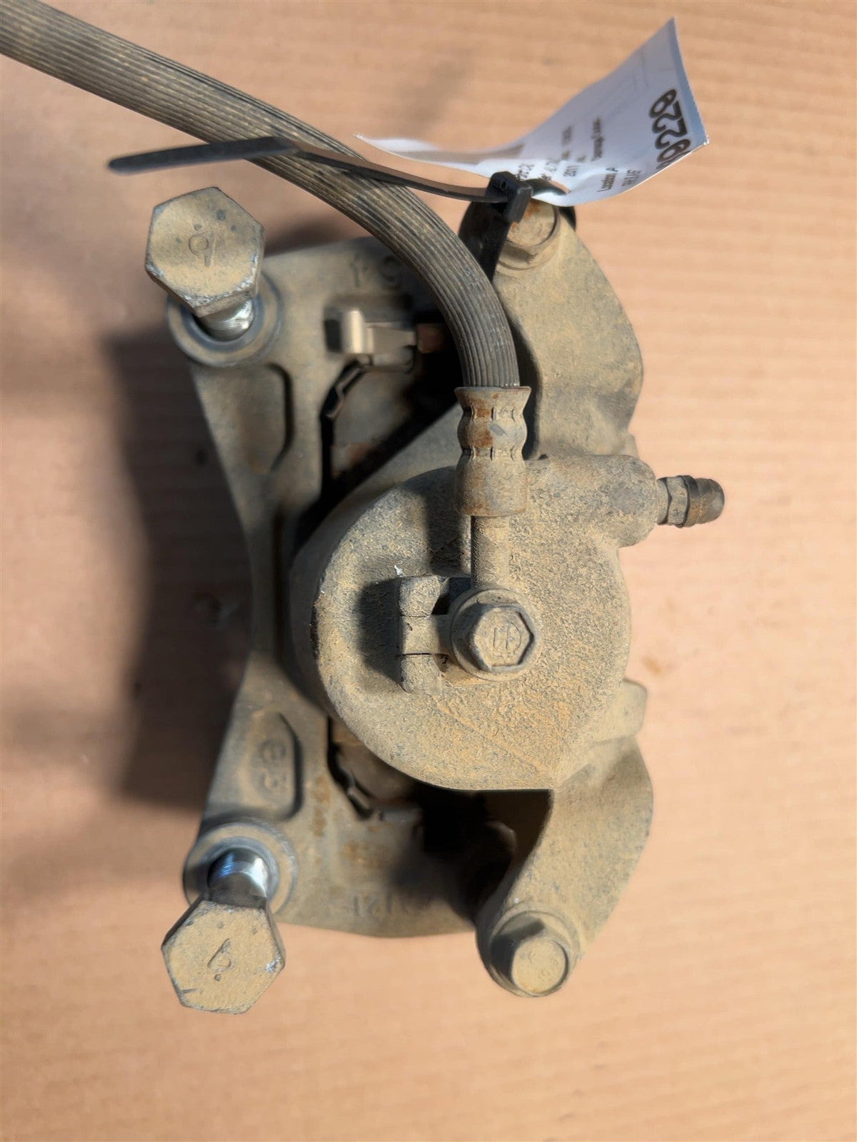 Brake Caliper from a 2011 Nissan Altima, front, right side, photo 1