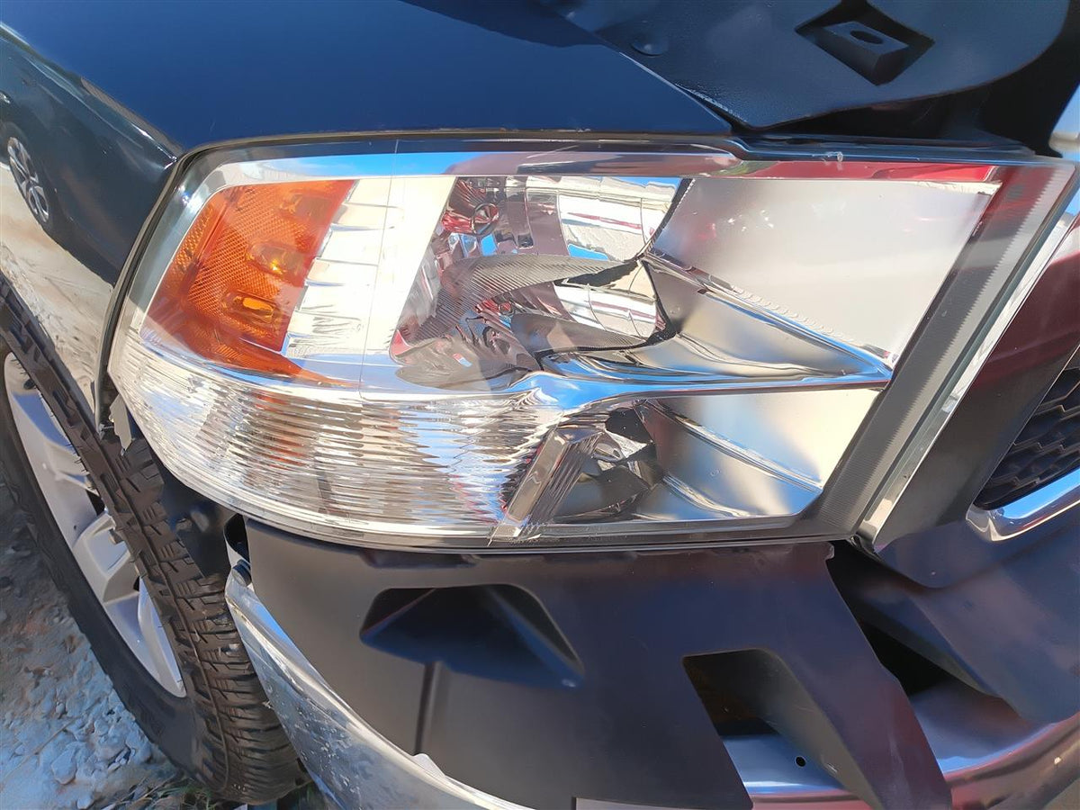 Headlight Assembly from a 2018 Ram 1500, right side, photo 1